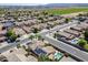 Residential neighborhood featuring homes with pools, solar panels, and well-maintained streets at 16186 W Port Royale Ln, Surprise, AZ 85379