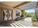 Cozy covered back patio featuring natural light, ideal for relaxing and enjoying the outdoor space at 16186 W Port Royale Ln, Surprise, AZ 85379