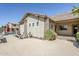 Exterior view showing a patio, desert landscaping, home architecture and backyard with a pool at 16186 W Port Royale Ln, Surprise, AZ 85379