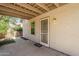 Exterior backyard patio features a secure security door, with direct access to the beautiful backyard at 16186 W Port Royale Ln, Surprise, AZ 85379