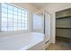 The bathroom features a tub/shower combination and access to the Primary closet at 16186 W Port Royale Ln, Surprise, AZ 85379