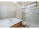 Bathroom featuring a shower, vanity, and framed mirror at 16186 W Port Royale Ln, Surprise, AZ 85379
