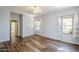 This bedroom boasts hard surface floors, light colored walls and natural light coming in from the windows at 16186 W Port Royale Ln, Surprise, AZ 85379
