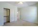 A bedroom with a closet, neutral walls, and carpeted floors at 16186 W Port Royale Ln, Surprise, AZ 85379