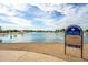 Community fishing lake with clear waters, providing a recreational spot for residents to enjoy fishing and outdoor activities at 16186 W Port Royale Ln, Surprise, AZ 85379
