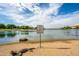 Lake with a clear view of the serene waterscape and adjacent park amenities, offering a tranquil recreational area at 16186 W Port Royale Ln, Surprise, AZ 85379