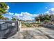 A lakeside memorial and artistic installation enhances the community's aesthetic appeal and commemorates local figures at 16186 W Port Royale Ln, Surprise, AZ 85379