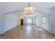 Spacious living space with tile floors, a ceiling fan, and an open concept design at 16186 W Port Royale Ln, Surprise, AZ 85379