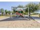 Community playground featuring covered slides and climbing structures, perfect for Gathering fun at 16186 W Port Royale Ln, Surprise, AZ 85379
