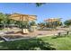 A community playground offers shaded play structures and swings for enjoyment at 16186 W Port Royale Ln, Surprise, AZ 85379