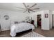 Bright bedroom featuring a ceiling fan, walk-in closet, and contemporary decor at 16526 W Desert Ln, Surprise, AZ 85388
