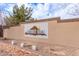 Decorative Northwest Ranch community sign with stone accents, lush landscaping, and a bright sky at 16526 W Desert Ln, Surprise, AZ 85388