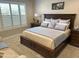 Tranquil primary bedroom offering custom window shutters and an upholstered sitting area at 16822 W Catalina Dr, Goodyear, AZ 85395