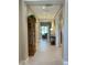 Inviting hallway with tile flooring, neutral colored walls, and views to the living area at 16822 W Catalina Dr, Goodyear, AZ 85395