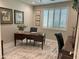 Cozy office with natural light, plantation shutters, and neutral colored walls at 16822 W Catalina Dr, Goodyear, AZ 85395