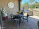 Patio seating area with a built-in grill and a serene outdoor dining experience at 16822 W Catalina Dr, Goodyear, AZ 85395