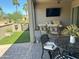 Cozy patio with comfortable seating, artificial turf, and a view of the surrounding neighborhood at 16822 W Catalina Dr, Goodyear, AZ 85395