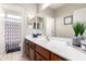 Well-lit bathroom featuring a spacious vanity, modern fixtures, and clean design at 17717 W Mandalay Ln, Surprise, AZ 85388
