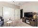 Versatile bonus room with a TV area, closet, and seating at 17717 W Mandalay Ln, Surprise, AZ 85388