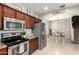 This spacious kitchen boasts stainless steel appliances, granite countertops, and ample cabinet space at 17717 W Mandalay Ln, Surprise, AZ 85388