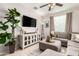 Relaxing living room featuring neutral tones, plush seating, and a large window at 17717 W Mandalay Ln, Surprise, AZ 85388