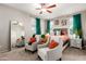 Bright main bedroom with neutral tones, ceiling fan, and ample natural light at 17717 W Mandalay Ln, Surprise, AZ 85388