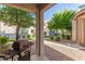 Covered patio area with grill, offering a relaxing outdoor space for entertaining at 17717 W Mandalay Ln, Surprise, AZ 85388