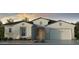 Beautiful single-story home with a neutral color scheme and a well-manicured front yard at 17807 W Pasadena Ave, Litchfield Park, AZ 85340
