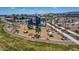 Aerial view of the playground with climbing structure, benches, and well maintained landscaping at 17831 W Pasadena Ave, Litchfield Park, AZ 85340