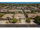 Exterior aerial view of a suburban neighborhood, featuring multiple residential houses at 1904 E Grand Canyon Dr, Chandler, AZ 85249