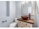 Bathroom with custom sink and vanity with rustic accents and modern fixtures at 1904 E Grand Canyon Dr, Chandler, AZ 85249