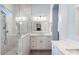 Elegant bathroom with walk-in shower, dual vanities, and luxurious marble countertops at 1904 E Grand Canyon Dr, Chandler, AZ 85249
