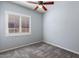 Bedroom with a ceiling fan and shuttered windows providing natural light at 1904 E Grand Canyon Dr, Chandler, AZ 85249