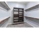 Spacious walk-in closet with custom shelving and ample storage solutions at 1904 E Grand Canyon Dr, Chandler, AZ 85249