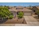 Well-maintained single-Gathering home with desert landscaping, a tile roof, and an attached two-car garage at 1904 E Grand Canyon Dr, Chandler, AZ 85249