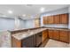 Kitchen boasts sleek appliances, ample countertop space, and seamless flow into the living area at 1904 E Grand Canyon Dr, Chandler, AZ 85249