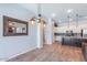Bright living space featuring tile floors, modern light fixtures and an open view of the kitchen at 1904 E Grand Canyon Dr, Chandler, AZ 85249