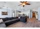 Spacious open-concept living room with tile floors, an inviting kitchen, and cozy sectional seating at 1904 E Grand Canyon Dr, Chandler, AZ 85249