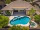 Aerial shot of the private pool and jacuzzi with desert landscaping and a covered patio at 1904 E Grand Canyon Dr, Chandler, AZ 85249