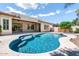 Inviting backyard pool and covered patio, ideal for outdoor gatherings and enjoying the beautiful weather at 1904 E Grand Canyon Dr, Chandler, AZ 85249