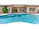 Stunning backyard pool with water feature and patio area, perfect for entertaining and relaxing by the water at 1904 E Grand Canyon Dr, Chandler, AZ 85249
