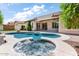 Backyard pool and spa with patio, perfect for outdoor relaxation and entertaining in a serene setting at 1904 E Grand Canyon Dr, Chandler, AZ 85249