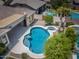 An aerial view of a private pool with attached hot tub and desert landscaping in the backyard at 1904 E Grand Canyon Dr, Chandler, AZ 85249