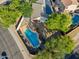 An aerial shot of the backyard featuring a private pool and drought-resistant landscaping at 1924 S Rome St, Gilbert, AZ 85295