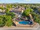 Beautiful aerial view of a property with a pool and desert landscaping at 1924 S Rome St, Gilbert, AZ 85295