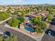 This gorgeous aerial shot showcases the home's private pool and beautiful mature landscaping at 1924 S Rome St, Gilbert, AZ 85295