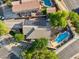 Aerial view of the home showcasing a pool, solar panels, and manicured landscaping at 1924 S Rome St, Gilbert, AZ 85295