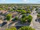 A bird's-eye view shows a spacious community with mature trees and well-maintained yards at 1924 S Rome St, Gilbert, AZ 85295