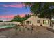 Backyard with a pool, gravel landscaping, and desert vegetation at 1924 S Rome St, Gilbert, AZ 85295