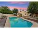 Enjoy this refreshing pool area with mature trees and a built in seating area around a fire pit at 1924 S Rome St, Gilbert, AZ 85295